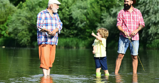 Dad, Son and Grandson, fishing in a river