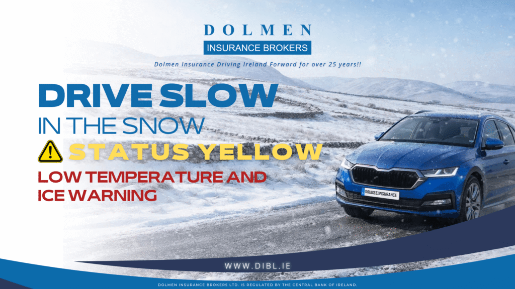 Blue car driving in winter weather with snow on the road and in the field